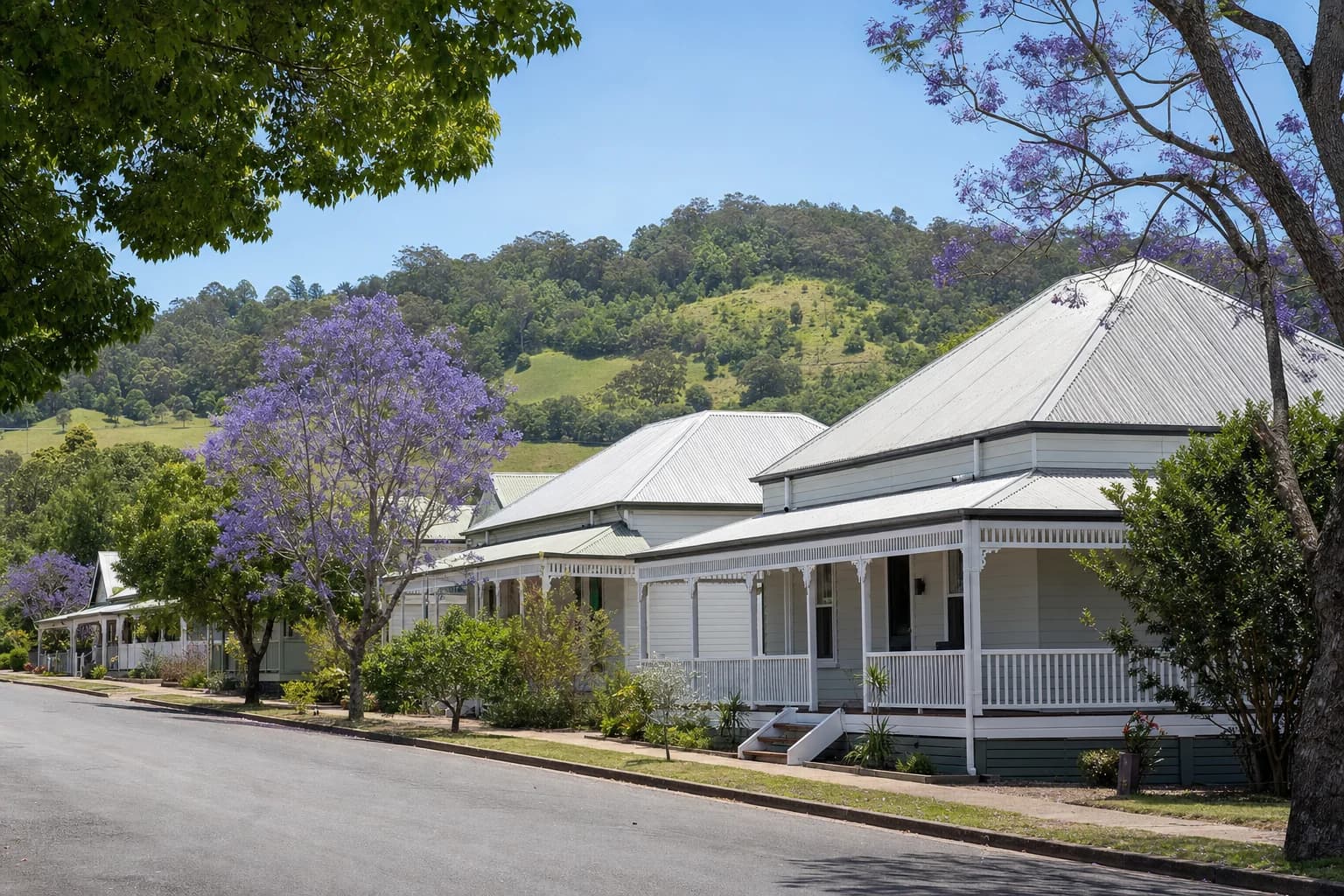 A street of restored weatherboard cottages in Bangalow