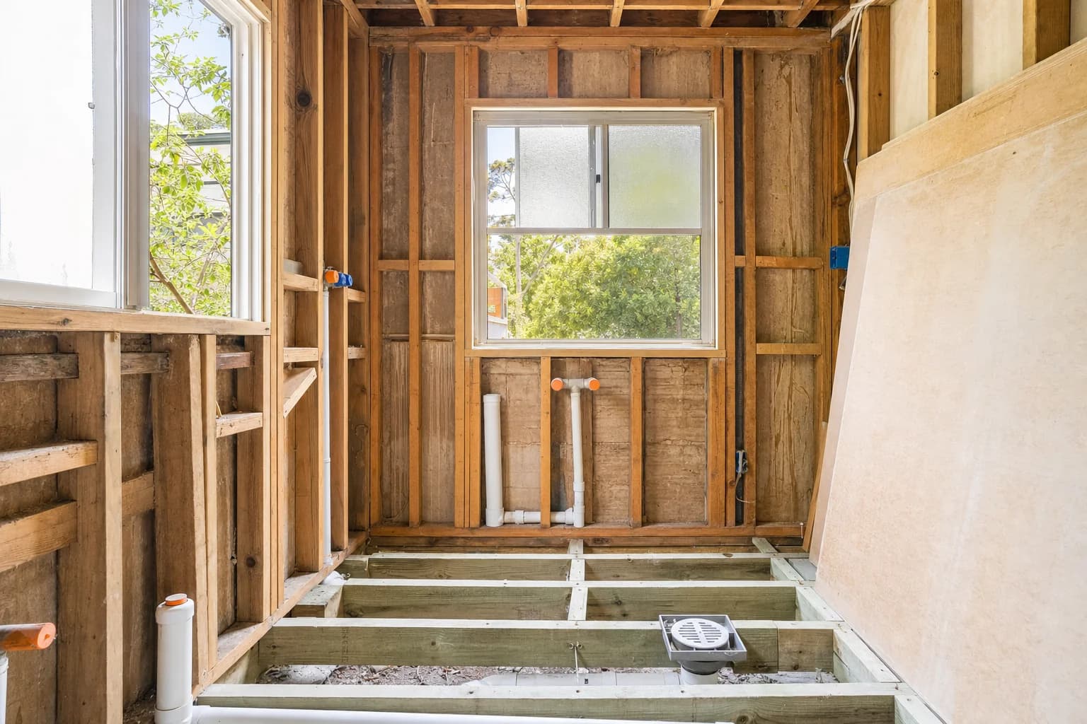 A bathroom stripped back to the frame with the old fixtures and lining removed