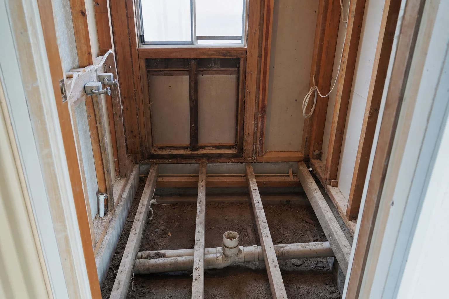 An ensuite stripped back to the frame before rebuilding
