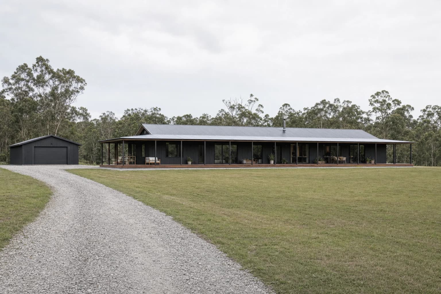 A long low rural house on a large open block at Ewingsdale with a shed behind it
