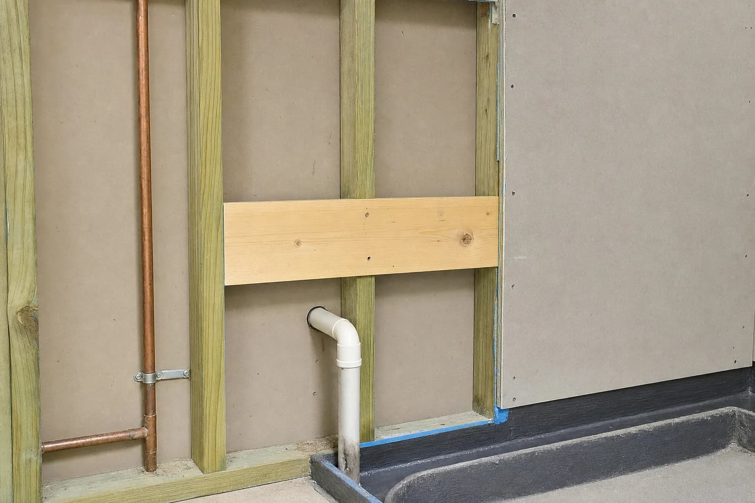 Timber blocking fixed in a wall ready for a grab rail before lining