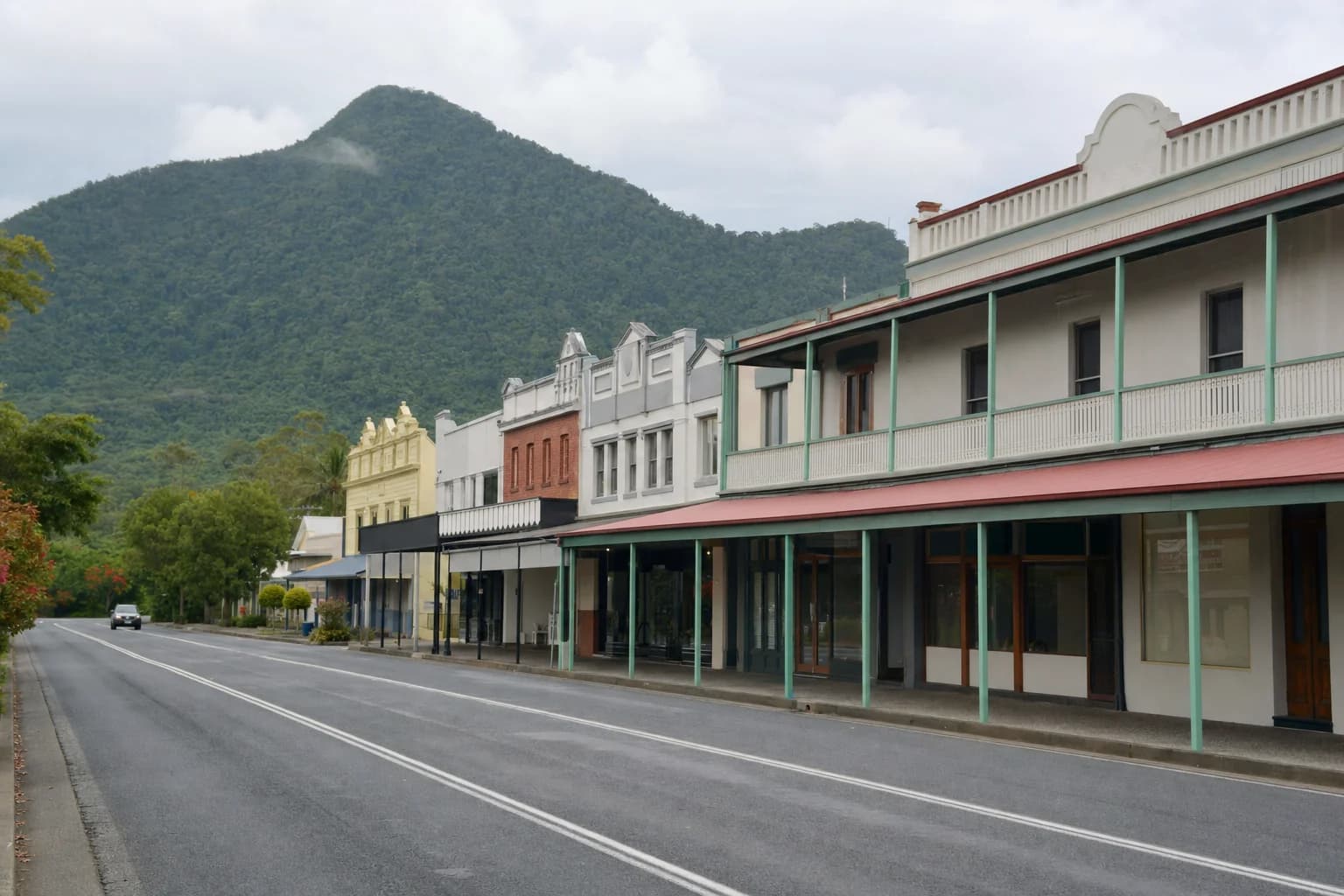 The heritage main street of Mullumbimby with deep verandah awnings and a green hill behind