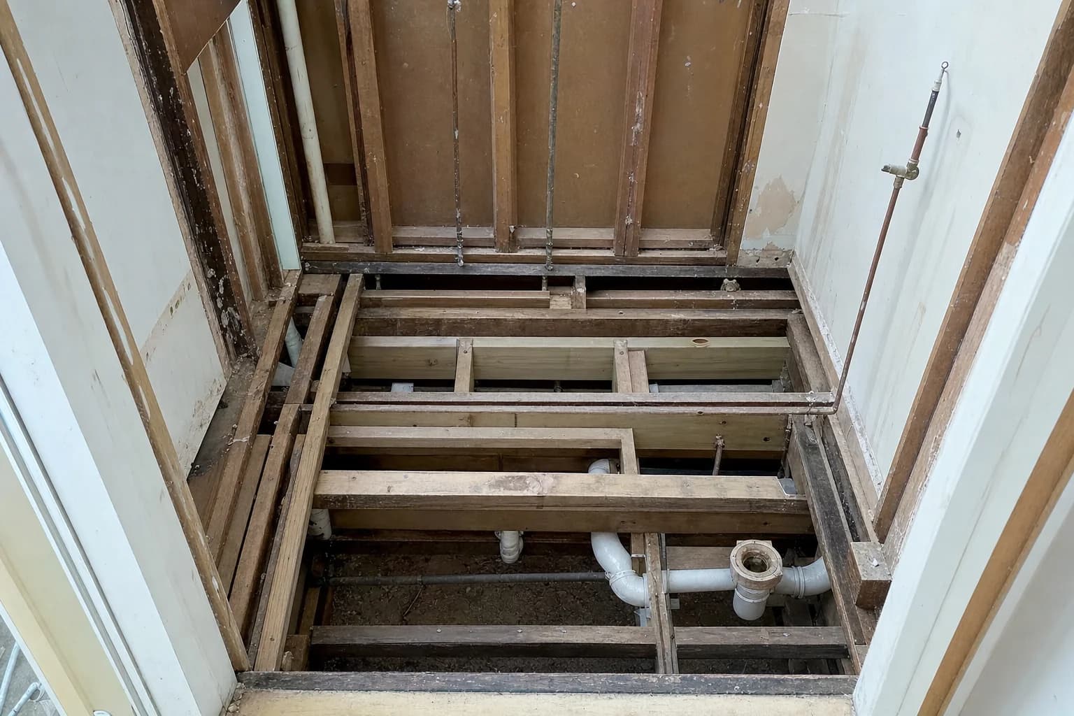 A bathroom stripped back to the frame with the old lining and fixtures removed